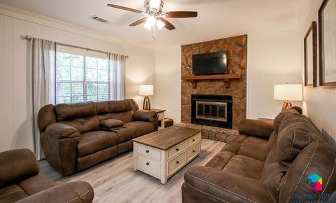 Living Room with reclining couches | Celling Fan | Smart TV