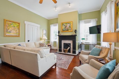 The living room is spacious and inviting, featuring comfortable seating, a flat-screen TV, and plenty of natural light. It''s the perfect spot to relax and unwind after a day of exploring.