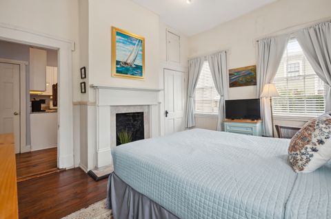 Bedroom 1 features a comfortable queen-sized bed with soft linens, creating a cozy and relaxing atmosphere for your stay. Perfect for a restful night''s sleep.