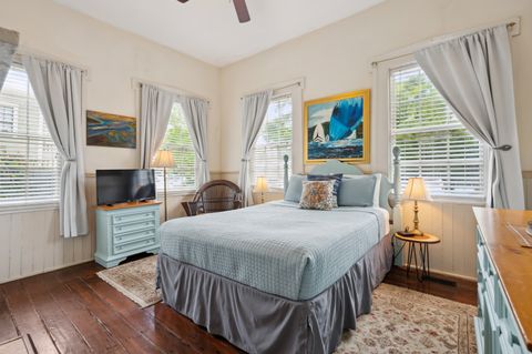 Bedroom 1 features a comfortable queen-sized bed with soft linens, creating a cozy and relaxing atmosphere for your stay. Perfect for a restful night''s sleep.