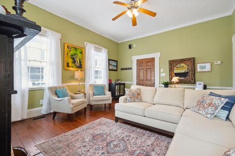 The living room is spacious and inviting, featuring comfortable seating, a flat-screen TV, and plenty of natural light. It''s the perfect spot to relax and unwind after a day of exploring.