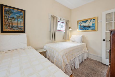 Bedroom 2 features two cozy twin beds, providing a comfortable and inviting space for guests. Ideal for families or friends, this room offers a restful retreat with ample natural light and a relaxed atmosphere.