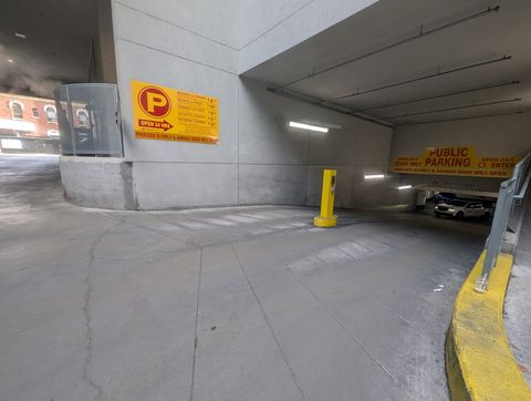 Continue to follow the ramp to enter underground parking lot.