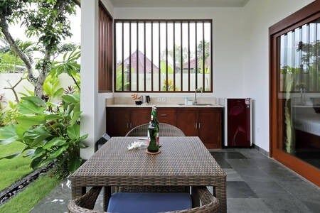 Kitchenette with all needed amentities. Dinning area with table and chairs, where you can work, if needed.