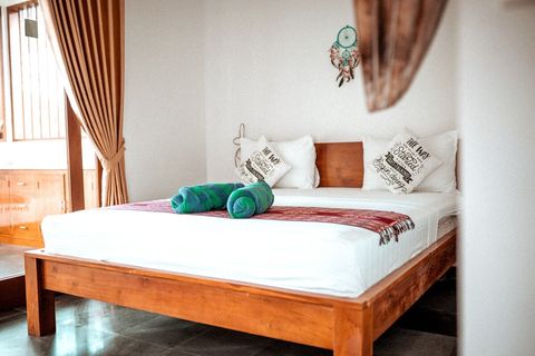 Spacious king bed with comfy mattress dominates minimalist but stylish bedroom. 