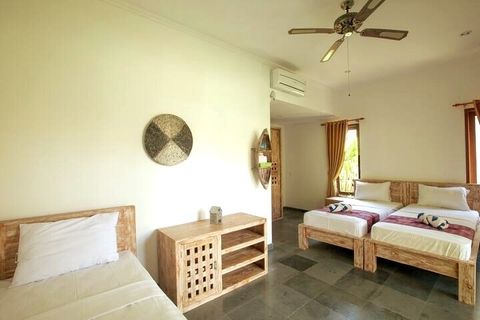 Three single beds dominate minimalist, but stylish bedroom. 
Blind curtains are available, bedroom is full of light otherwise.