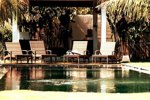 Middle area of garden is shared. Loungers are ready for your sunbathing.