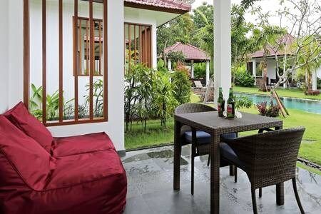 Dining area with table and chairs, where you can work, if needed. And comfy bean bags for your relaxation are here too.