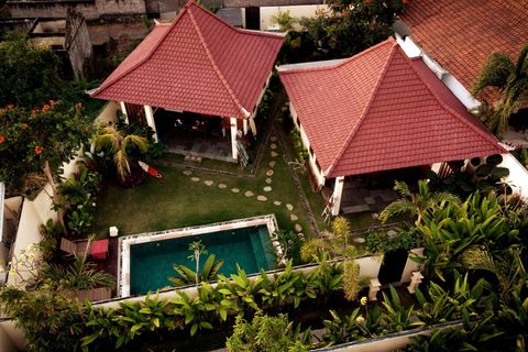 Yours is the left villa.
Garden area and pool is shared, if there will be guests in other villa at the same time. 
Otherwise you will have it only for yourself.