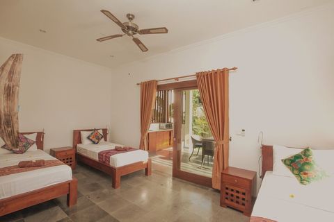 Bedroom has 3 twin beds with high comfy mattresses. Minimalist, but stylish bedroom with an accent to Balinese culture. Ideal for friends or family of three!