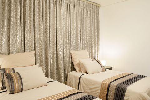 The two three-quarter beds in the bedroom