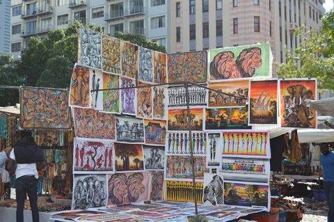 Hand paintings that are on display on the square below the apartment that can be viewed and bought