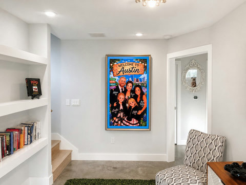 Our welcoming entry doubles as a cozy reading nook with a curated book collection. Our Frame TV greets your group with a personalized welcome, making your stay feel special from the moment you arrive.