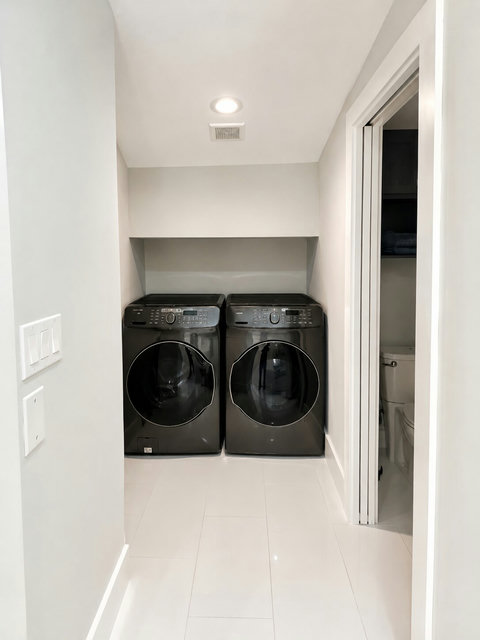 Enjoy the convenience of a full-size washer and dryer located just off the primary bedroom. One of two laundry areas available in the home.