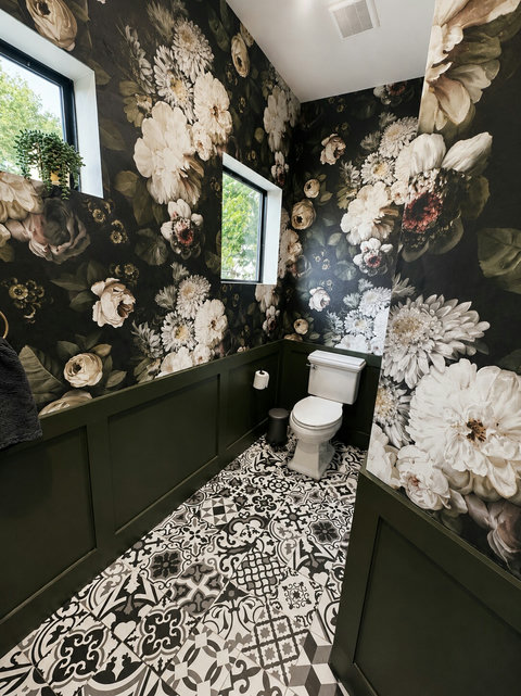 A moody, vibey powder room with bold floral walls and eye-catching tile.
