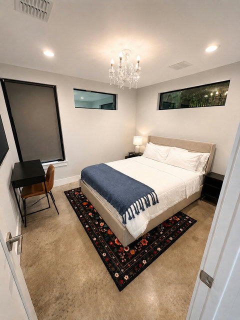 A bright and inviting guest bedroom with a plush queen bed, luxury linens, and a peaceful atmosphere for a restful night's sleep.