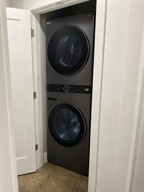 The home features a second laundry area with an LG WashTower, making it easy to split loads or keep up with laundry during your stay.