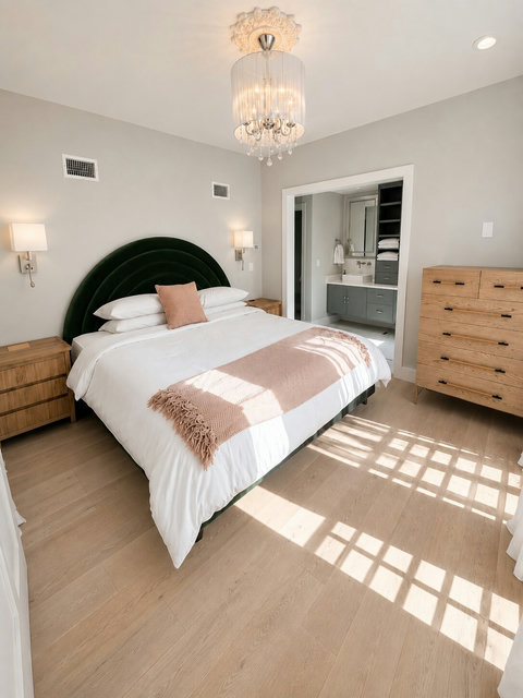 Wake up in the spacious primary suite featuring a plush king bed, spa-inspired ensuite bathroom, and direct access to your private terrace and rooftop deck.