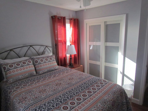 Our queen bedroom with comfortable pillow topped mattress and 43" SMART tv