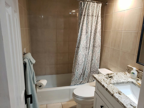 Guest bath with tub/shower combo, new chair height toilet and new vanity with quartz countertop as well.
