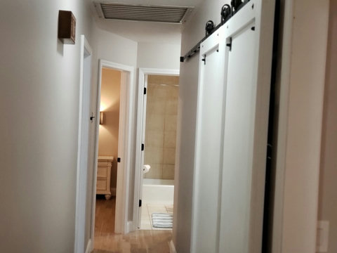 Another view of custom built barn door that my husband made to slide to allow for easy access to the washer and dryer.