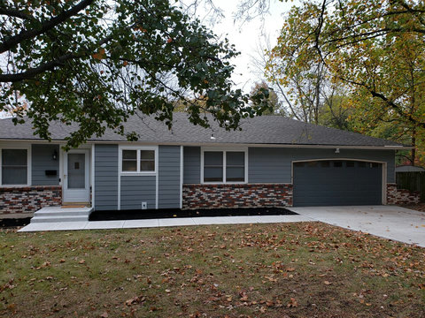 Another view of the front of the house with an easy level walkway to the front door with only two steps to get inside.