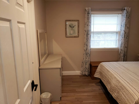 Another view of the queen bedroom and dresser.