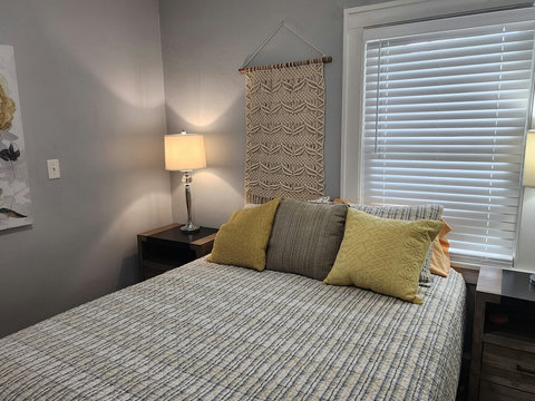 Front queen bedroom with awesome nightstands that have plugins and usb. 