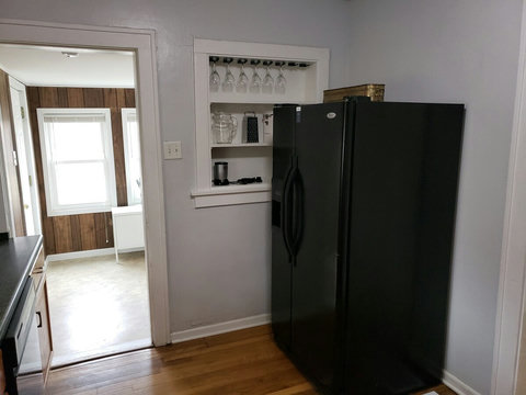 Fridge with ice maker and built in custom shelf that has the wine glasses and other smaller kitchen stuff. We even have a magic bullet.