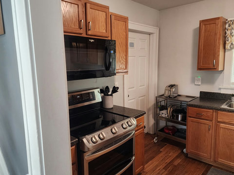 Another large view of stove-rolling bar car that holds crockpot, toaster and even quesadilla maker. Cart even rolls if you like to the dining room for easier serving.