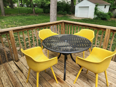 Cute patio table and chairs overlooking fenced in back yard. Has lots of shade to enjoy the outdoors.