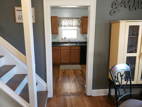 Close up of stairs and entrance to kitchen.