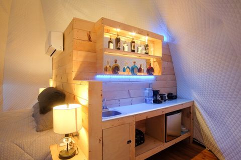 Bar service with fridge, water, coffee, sugar, cream and more.