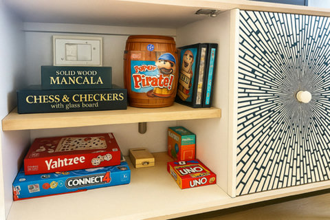 Cabinet stocked with family board games