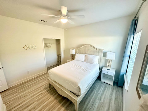 Coastal bedroom with soft blue curtains