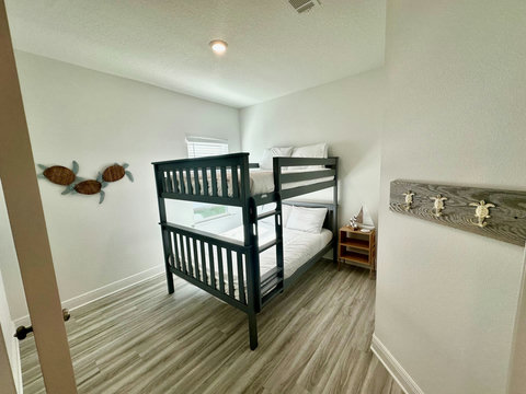 Charcoal bunk beds with coastal turtle accents