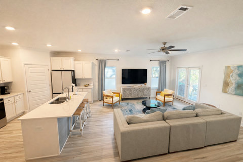 Bright kitchen island with coastal living area