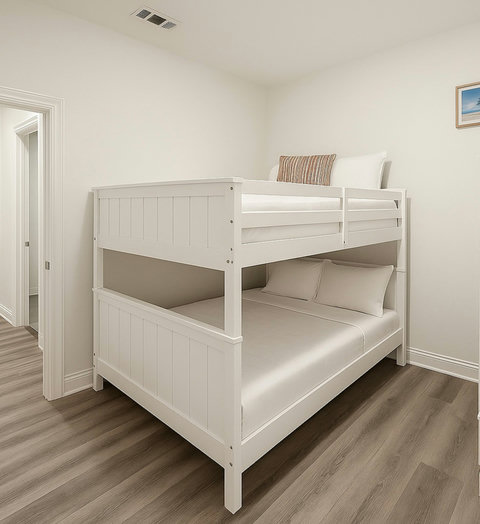 White bunk beds with striped accent pillows
