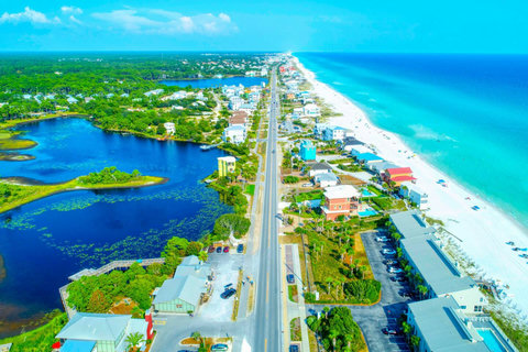 Aerial of 30A beach beside coastal dune lake