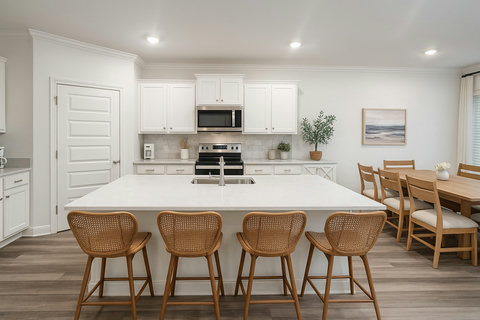 Kitchen island with rattan stools and dining nook
