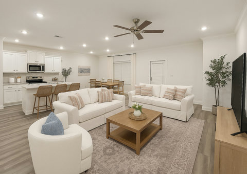 Open living, dining, and kitchen with coastal style