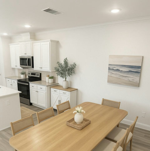 Airy kitchen and dining with beach wall art