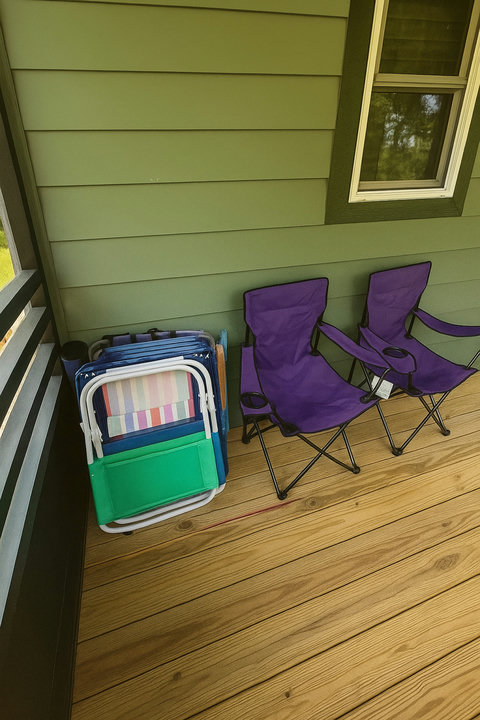 Beach chairs ready on the porch for guests