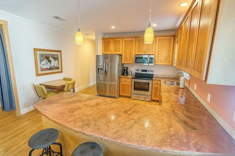 Kitchen breakfast bar with stainless appliances