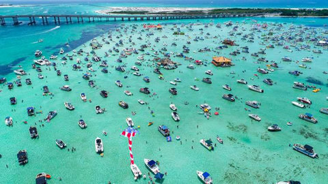 Lively Crab Island sandbar with turquoise water
