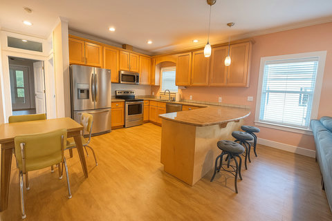 Spacious kitchen island with pendant lights