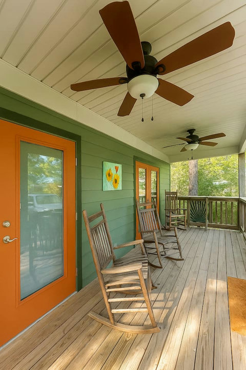 Covered porch lined with classic rocking chairs