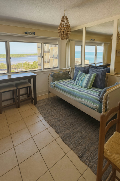 Spindle daybed and desk overlooking coastal lagoon