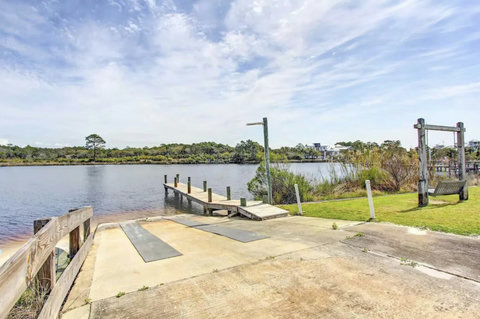Boat ramp, dock, and waterside porch swing