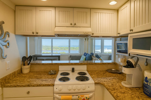 Open kitchen with water views through the pass-through